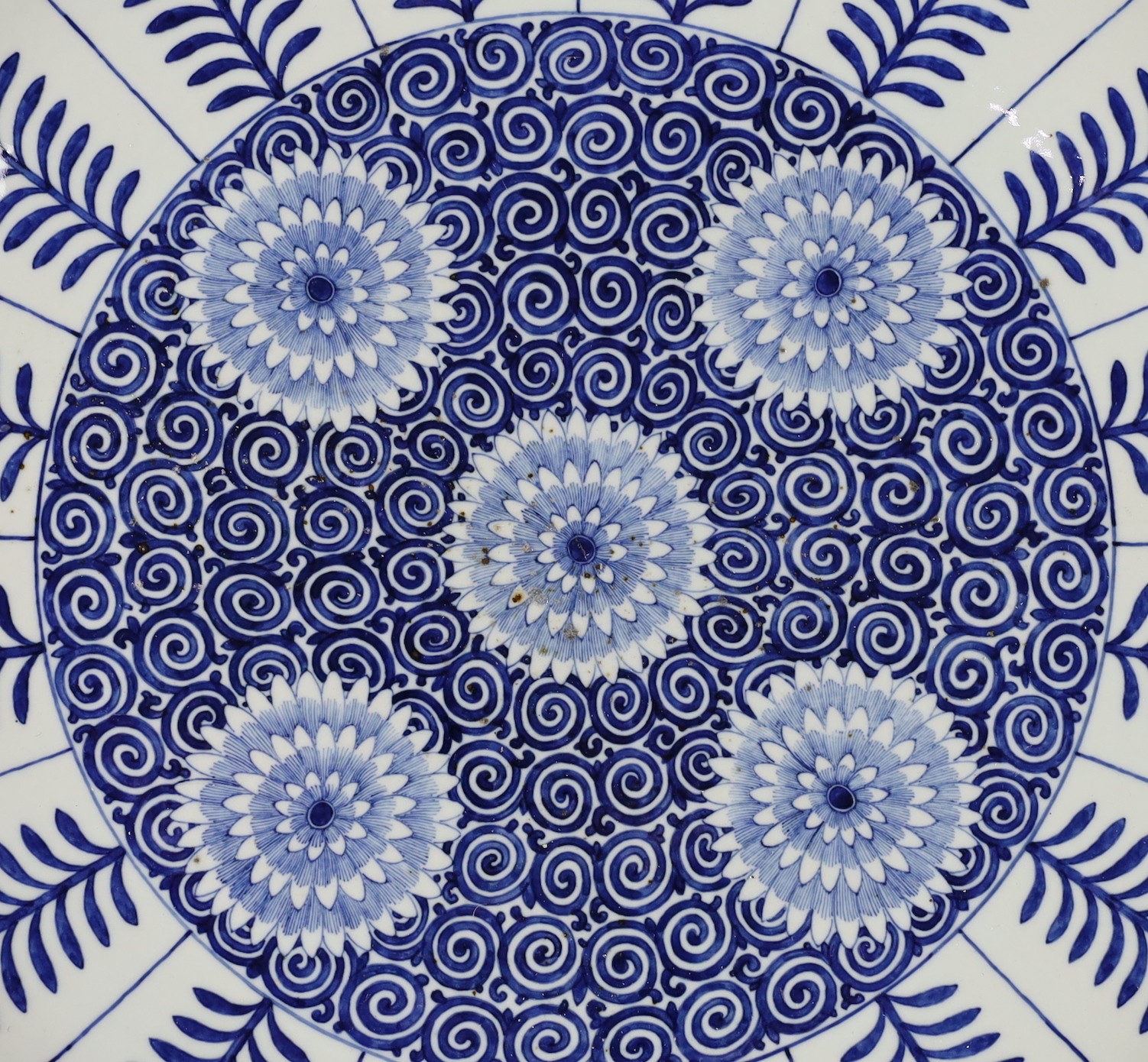A pair of massive Chinese blue and white Aster pattern dishes, Kangxi mark but Republic period, 54.5cm diameter, one with a small section broken and restuck
